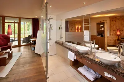 a bathroom with two sinks and a shower at Engels Park in Vipiteno