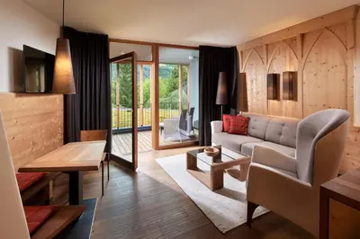 a living room with a couch and a table at Engels Park in Vipiteno