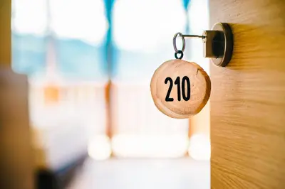 a lock on a door with the number on it at Gasthof Hotel Wöhrmaurer in Feldthurns
