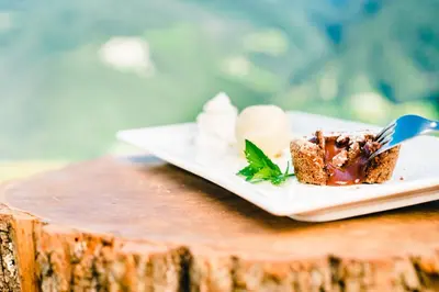 a plate with a piece of cake on a table at Gasthof Hotel Wöhrmaurer in Feldthurns
