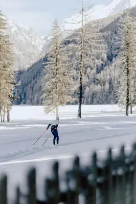 a person on skis in the snow on a lake at Garberhof Dolomit Family in Rasùn di Sotto