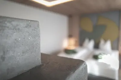 a close up of the corner of a concrete counter top at Garberhof Dolomit Family in Rasùn di Sotto