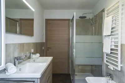 a bathroom with a sink and a shower at Apartments Jalve in Ortisei