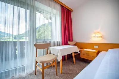a hotel room with a table and a window at Alara in Bulla