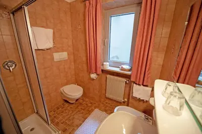 a bathroom with a shower and a toilet and a sink at Alara in Bulla