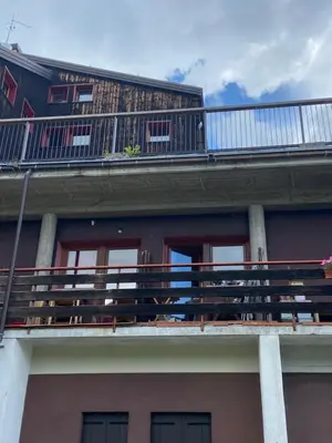 a balcony on the top of a building at Casa Focobon - presso Sussy residence in Falcade