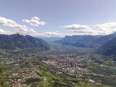 an aerial view of a city in the mountains at B&B Hotel Mair am Turm in Tirolo