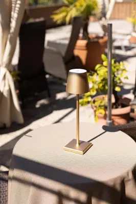 a small lamp sitting on top of a table at B&B Hotel Mair am Turm in Tirolo