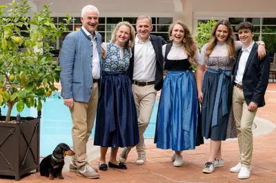 a group of people posing for a picture with a dog at Romantik Hotel Oberwirt in Marlengo