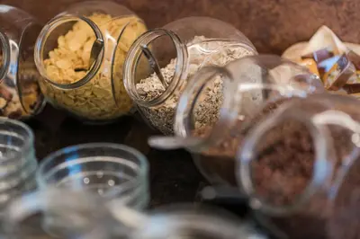 a group of glass containers filled with food at Hotel Weger in Tirolo