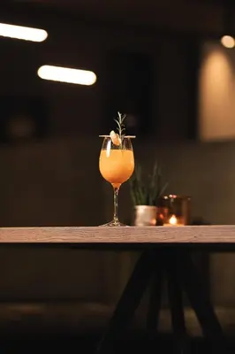 a drink sitting on top of a table at Terentnerhof 4*S active & lifestyle hotel in Terento