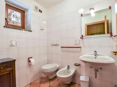 a bathroom with a toilet and a sink at Chalet Cesa Galadriel-1 by Interhome in Penia