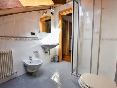 a bathroom with a sink and a toilet at Chalet Cesa Galadriel-1 by Interhome in Penia