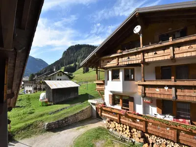 a cabin in the mountains covered in snow at Apartment Cesa Galadriel-2 by Interhome in Penia