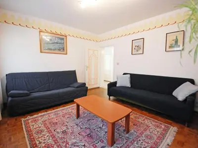 a living room with a couch and a coffee table at Apartment La Busa-1 by Interhome in Masarè