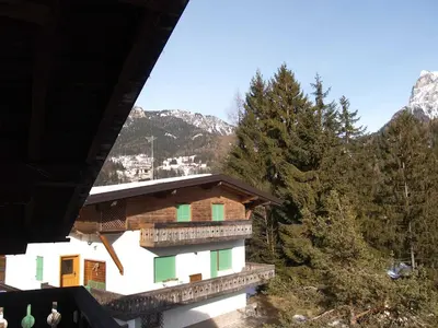 a building with a view of a lake and mountains at Apartment La Busa-1 by Interhome in Masarè