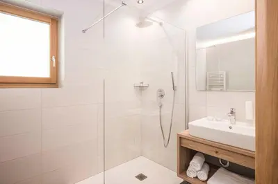 a bathroom with a shower and a sink at Gasthof Jaufensteg in Racines