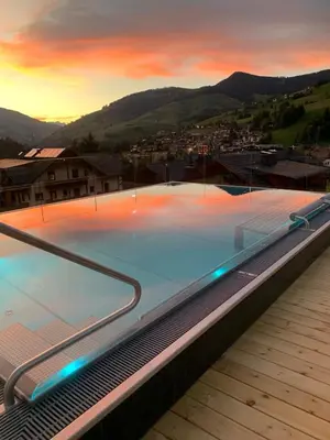 a large swimming pool on top of a building at Alpine Refuge Villa Adler in San Vigilio Di Marebbe