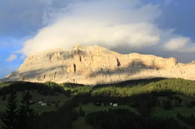 a large mountain in the middle of a forest at CIADIN APPART. in Badia