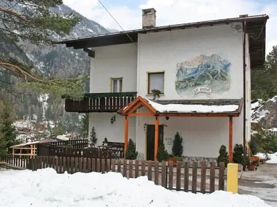 a building with a view of a lake and mountains at Apartment La Busa-2 by Interhome in Masarè