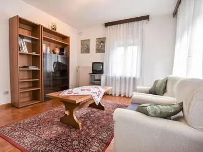 a living room with a coffee table and a couch at Apartment La Busa-2 by Interhome in Masarè