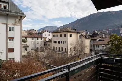 a view from a balcony of a city with buildings at Sunshine Apartments in Bolzano