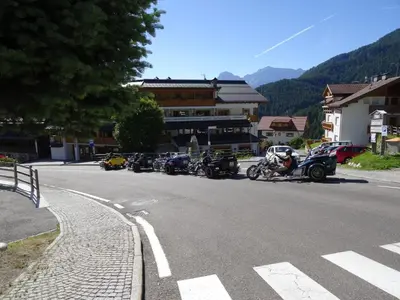 a group of motorcycles parked on the side of a street at Hotel Antermoia in Antermoia
