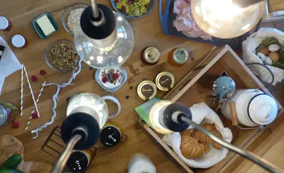 a wooden table with food and dishes on it at Seebacher Apartments in Sarntal