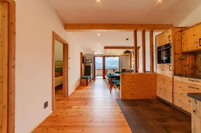 a kitchen and dining room with a view of the ocean at Huberhof in Villandro