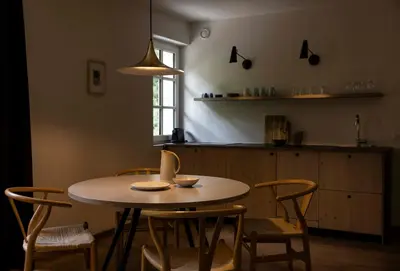 a living room with a couch and a chair and a window at Stern B&B & Apartments in Nova Levante