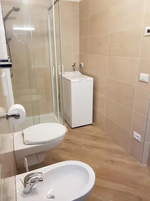 a bathroom with a toilet and a sink and a shower at Casa Alice 5.3 in Fiera di Primiero