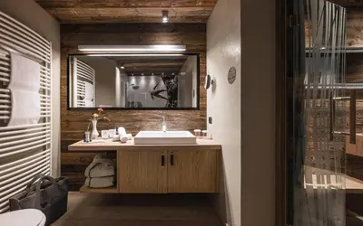 a log cabin in the snow at Alpine Boutique Villa Gabriela - Adults Only in Castelrotto