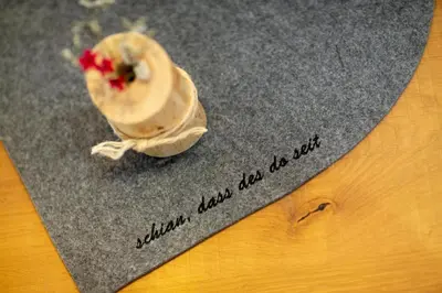 a toy shell sitting on top of a piece of paper at Waidacherhof Apartments in Braies