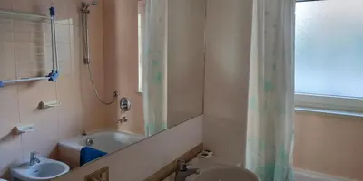 a bathroom with a sink and a toilet and a shower at Apartment 18 Federico Bandi Cavalese in Cavalese