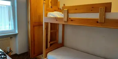 a couple of bunk beds in a room at Apartment 18 Federico Bandi Cavalese in Cavalese