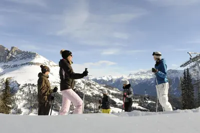 a group of people standing on top of a snow covered mountain at Hotel Castel Latemar in Carezza al Lago
