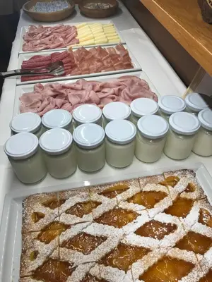 a buffet filled with lots of different types of food at Garni La Vara in Corvara in Badia