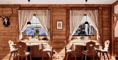 a room with a wooden desk with a laptop on it at Hotel Kristall in Maranza