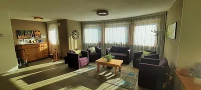 a living room with couches and a table at Residence Stefansdorf in Brunico