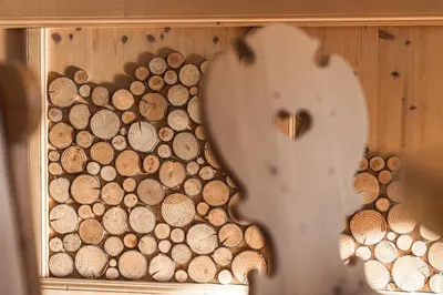 a wooden box filled with logs of wood at Hotel Sassleng in Canazei