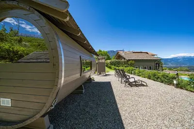 a building with a large window on the side of it at Hotel Sigmundskron in Appiano sulla Strada del Vino