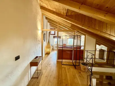 a hallway of a house with a wooden ceiling at Ansitz Jenner in Appiano sulla Strada del Vino
