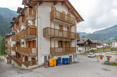 a building with balconies on the side of it at Casa Stella in Falcade