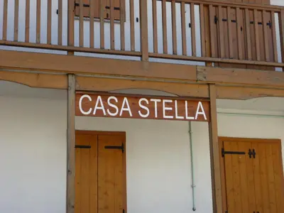 a sign that says casa stella in front of two doors at Casa Stella in Falcade