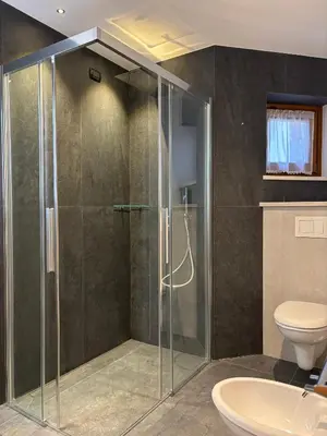 a bathroom with a shower and a toilet at Affittacamere Villa Sole in Fiera di Primiero