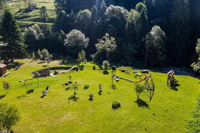 an aerial view of a park with a playground at Albergo Lozen in Canale San Bovo
