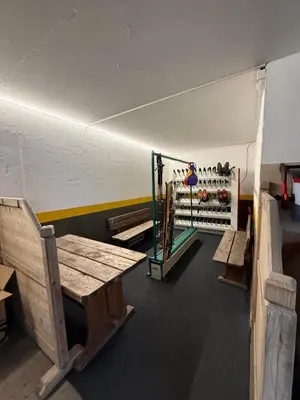 a gym with benches and a treadmill in a room at Fless in San Martino in Badia