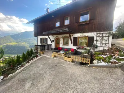 a house on top of a hill with at Fless in San Martino in Badia