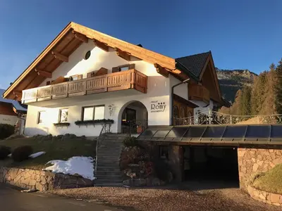 a house with a balcony on top of it at Chalet Romy - Ap Saslonch in Pramauron