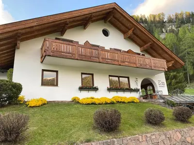 a house with a balcony on top of it at Chalet Romy - Ap Saslonch in Pramauron